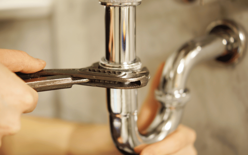 Siphon remonté et resserré après débouchage